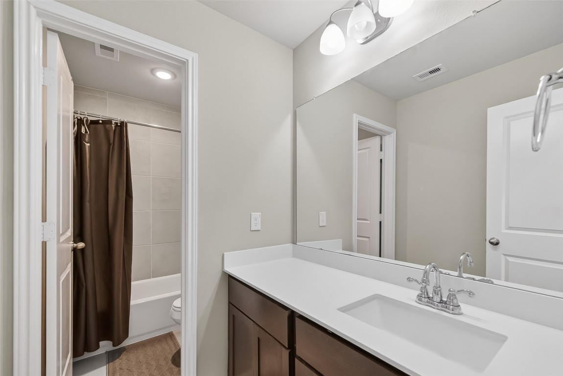 2739 Meadow View Lane Conroe, TX 77385 - Photo 23 of 50 a bathroom with a sink vanity granite and a mirror