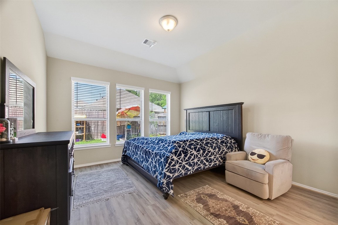 2739 Meadow View Lane Conroe, TX 77385 - Photo 31 of 50 a bedroom with a bed and window