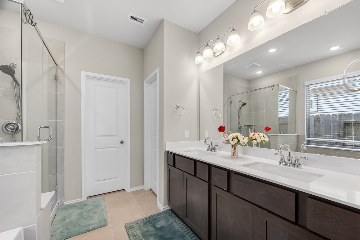 2739 Meadow View Lane Conroe, TX 77385 - Photo 34 of 50 a bathroom with a sink double vanity and a mirror
