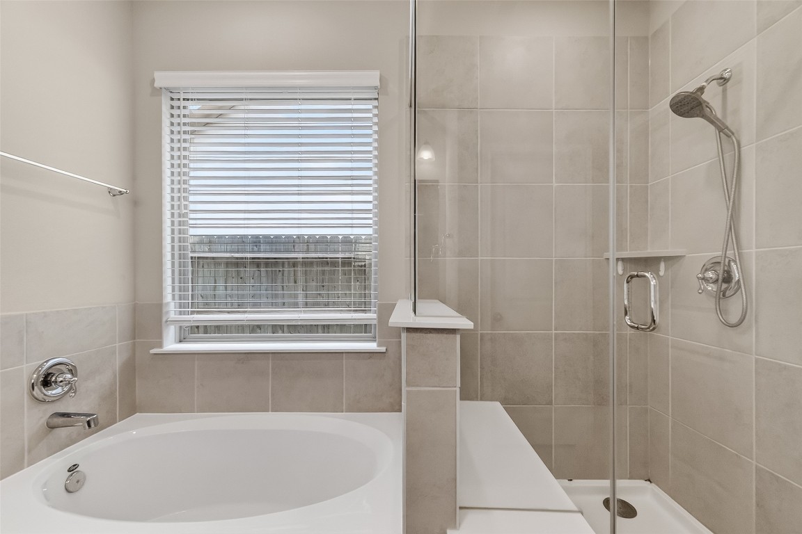 2739 Meadow View Lane Conroe, TX 77385 - Photo 36 of 50 a bathroom with a bathtub and shower
