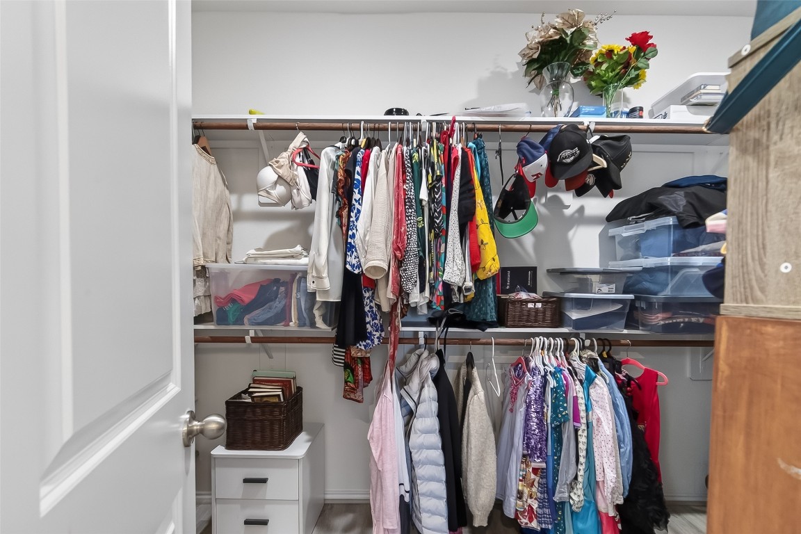 2739 Meadow View Lane Conroe, TX 77385 - Photo 37 of 50 a view of walk in closet with clothes and shoes
