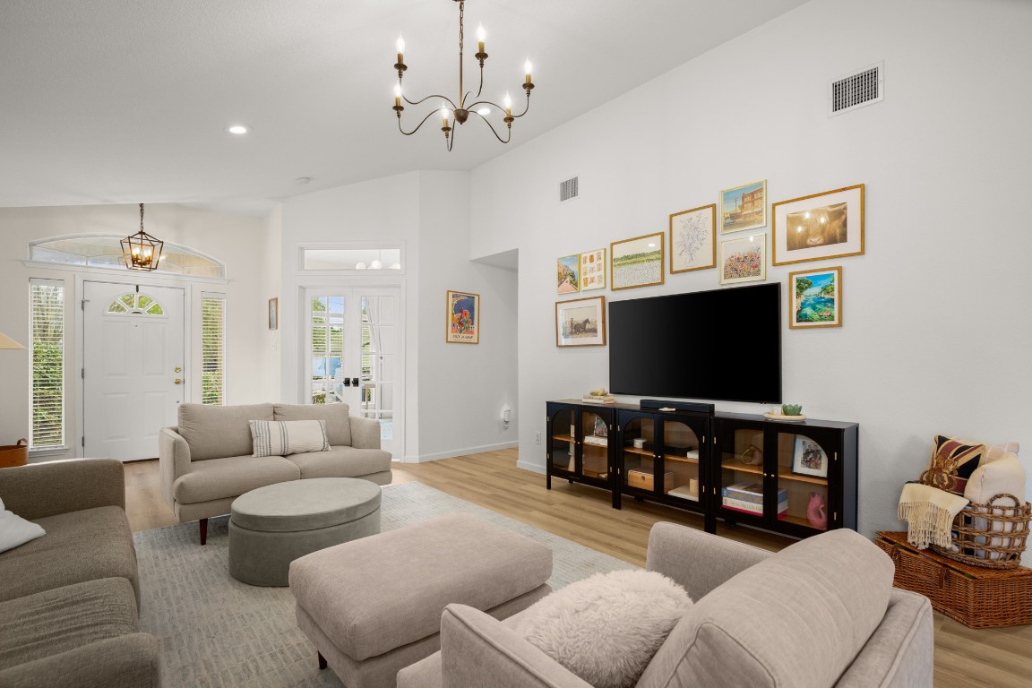 10220 Beard Avenue Austin, TX 78748 - Photo 1 of 1 a living room with furniture and a flat screen tv