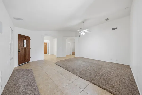 a kitchen with stainless steel appliances granite countertop a refrigerator a sink and a granite counter tops