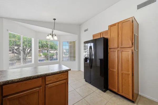 a view of a house with a tree in the background