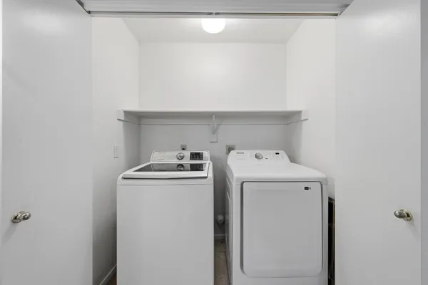 a view of an empty room with a window