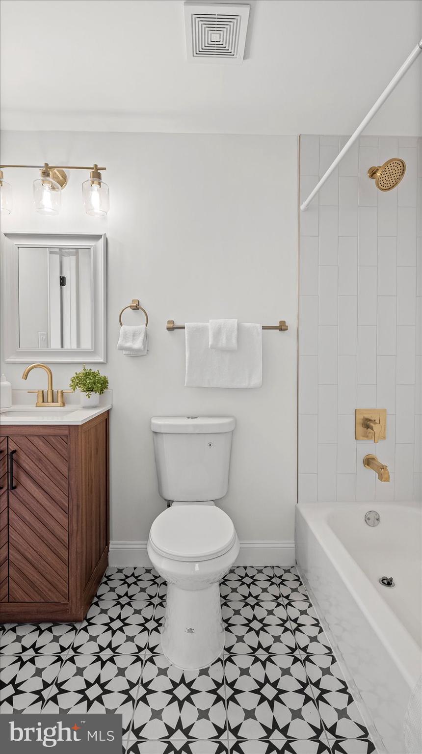 4817 Valley Forge Road Randallstown, MD 21133 - Photo 19 of 36 a bathroom with a sink toilet and shower