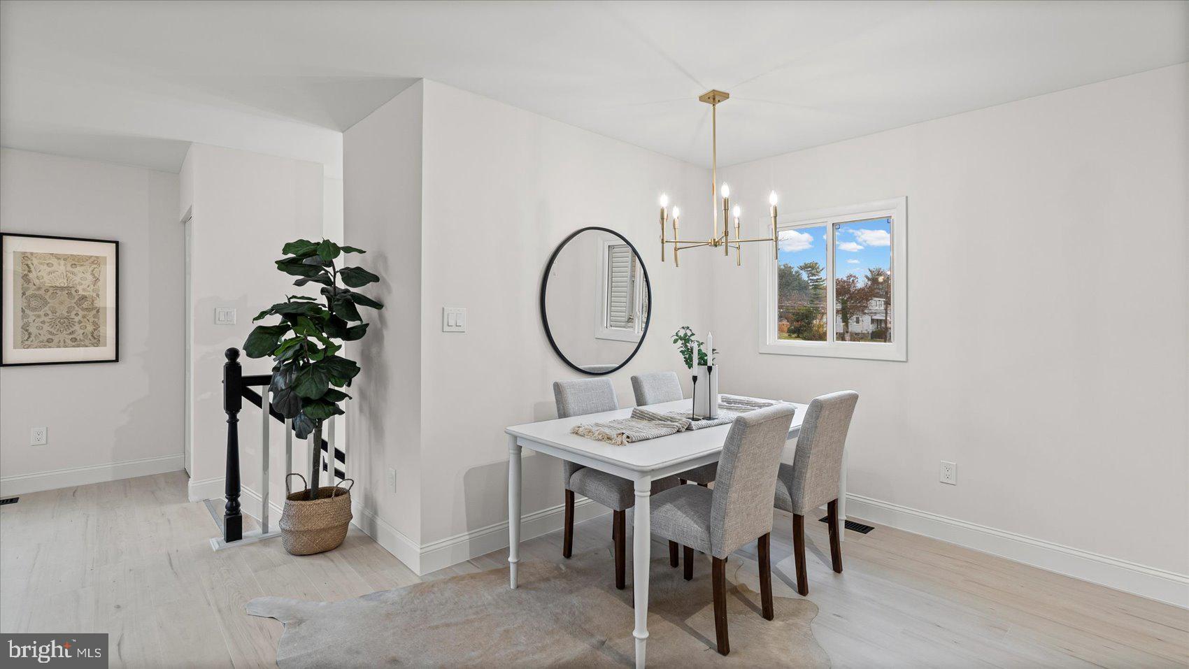 4817 Valley Forge Road Randallstown, MD 21133 - Photo 20 of 36 a view of a dining room with furniture and chandelier