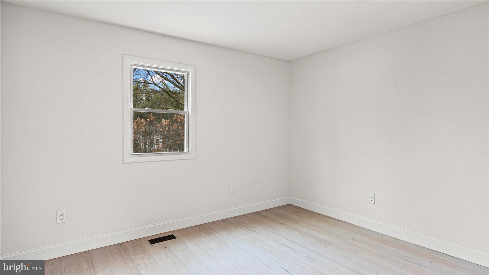 4817 Valley Forge Road Randallstown, MD 21133 - Photo 26 of 36 an empty room with a window