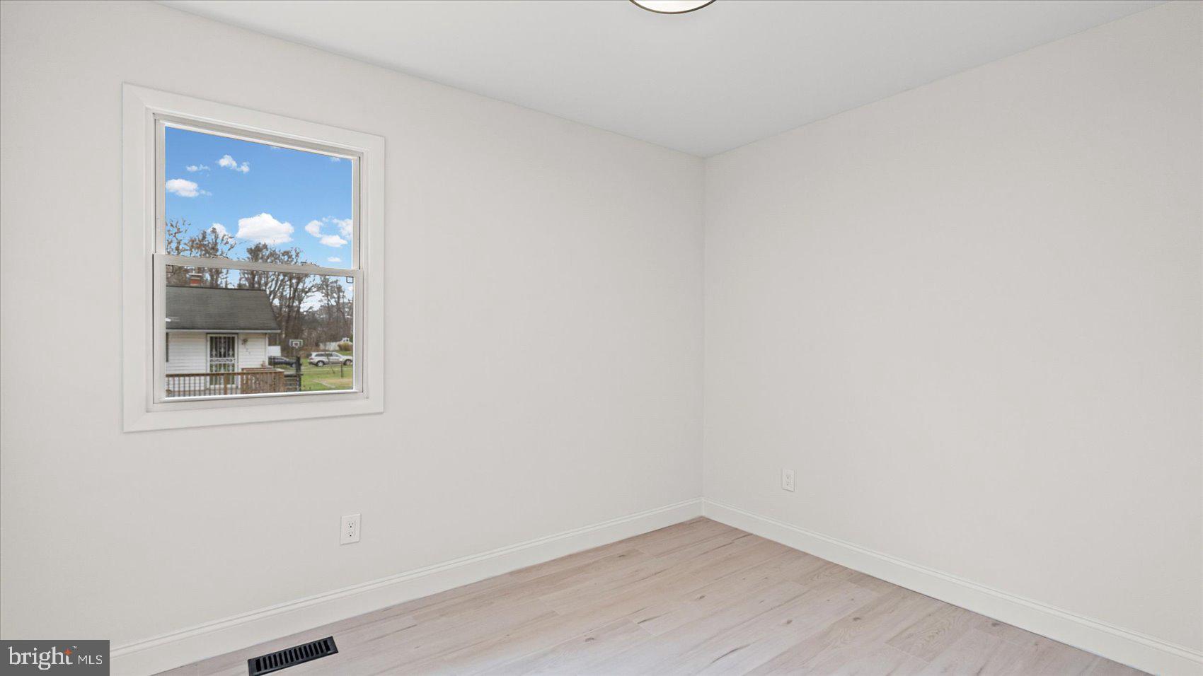 4817 Valley Forge Road Randallstown, MD 21133 - Photo 28 of 36 a view of a small space with wooden floor and a window