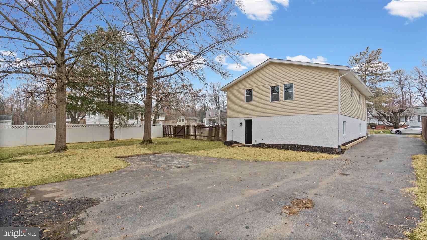4817 Valley Forge Road Randallstown, MD 21133 - Photo 34 of 36 a view of a house with a yard and garage