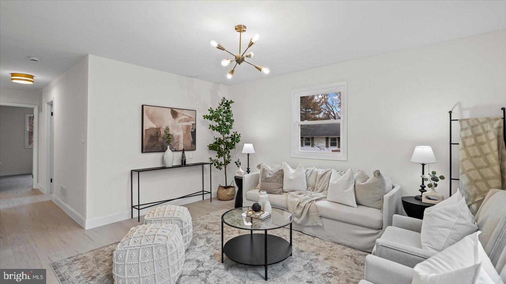 4817 Valley Forge Road Randallstown, MD 21133 - Photo 6 of 36 a living room with furniture a chandelier and a couch