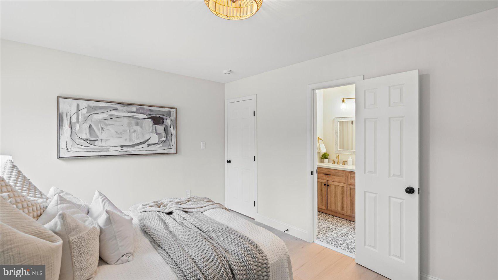 4817 Valley Forge Road Randallstown, MD 21133 - Photo 10 of 36 a view of a bedroom with bed and furniture
