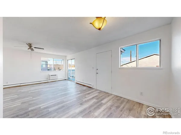 a view of an empty room and window