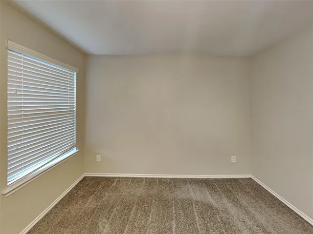 a bathroom with a sink a glass door and a mirror