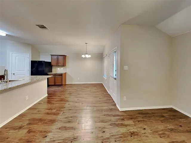 a view of a kitchen with a sink and a microwave