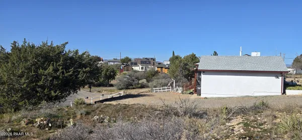 a view of a house with a yard and garage