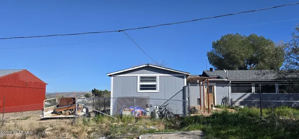 a view of a house with a yard and plants