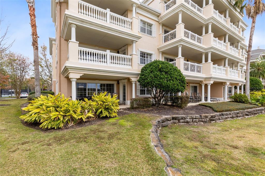 1368 Centre Ct Ridge Drive, Unit 104 Reunion, FL 34747 - Photo 26 of 33 front view of a building with a swimming pool