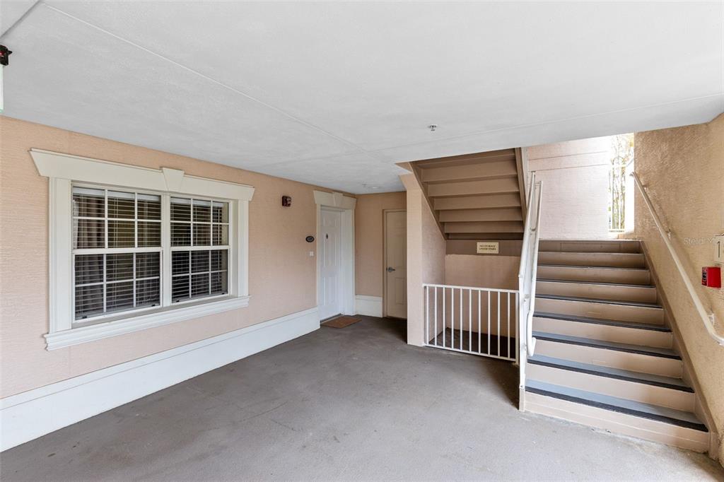 1368 Centre Ct Ridge Drive, Unit 104 Reunion, FL 34747 - Photo 27 of 33 a view of an empty room with a window and entryway