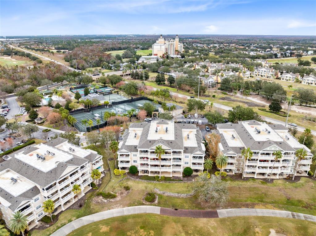 1368 Centre Ct Ridge Drive, Unit 104 Reunion, FL 34747 - Photo 30 of 33 an aerial view of residential houses with outdoor space