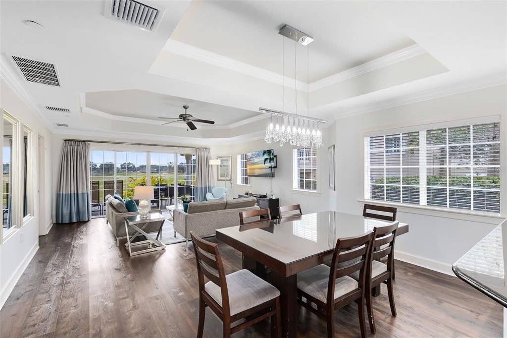 1368 Centre Ct Ridge Drive, Unit 104 Reunion, FL 34747 - Photo 6 of 33 a view of a dining room with furniture window and wooden floor