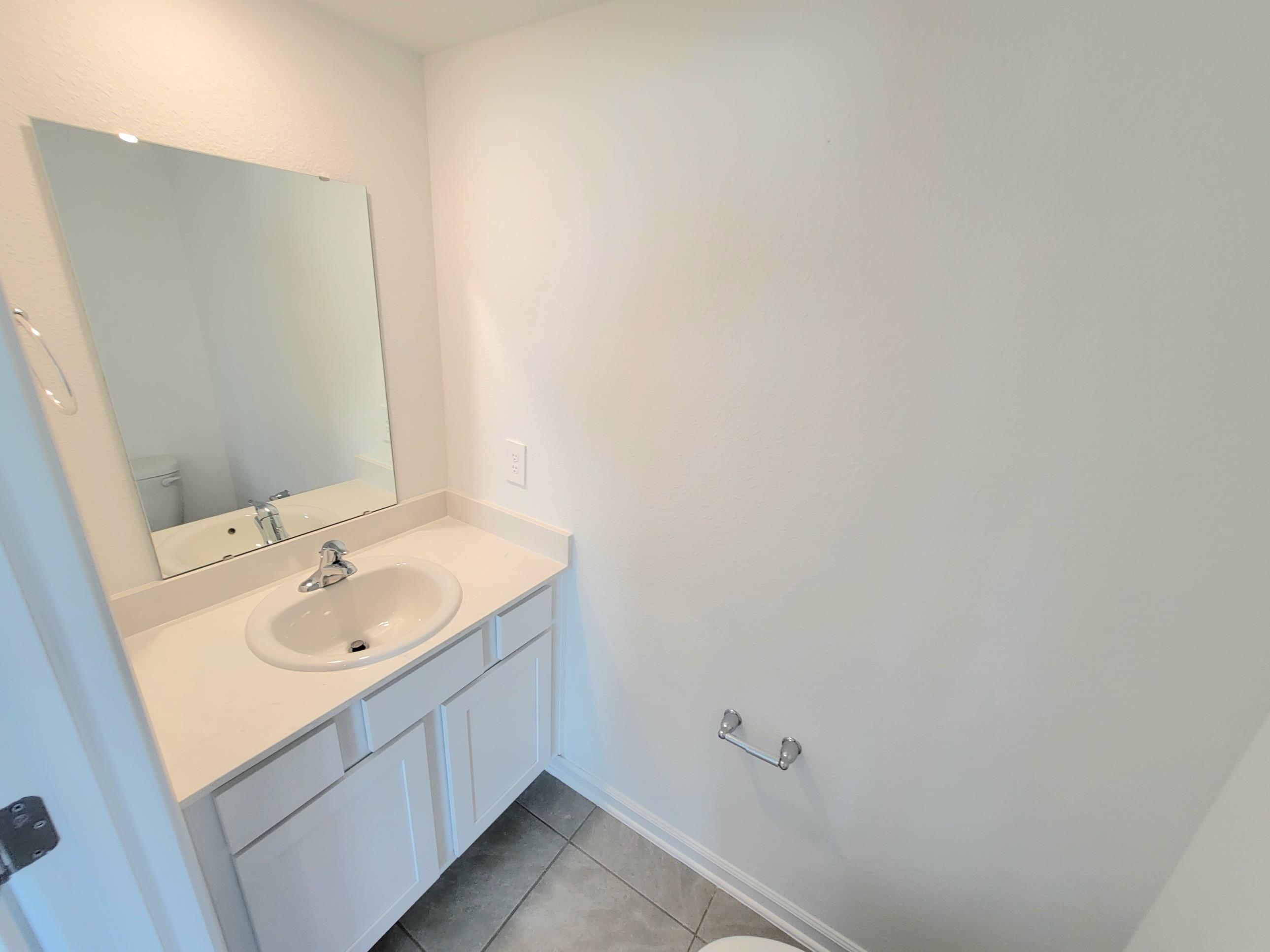 177 Tidal Bch Avenue St. Augustine, FL 32095 - Photo 12 of 39 a bathroom with a sink and a mirror