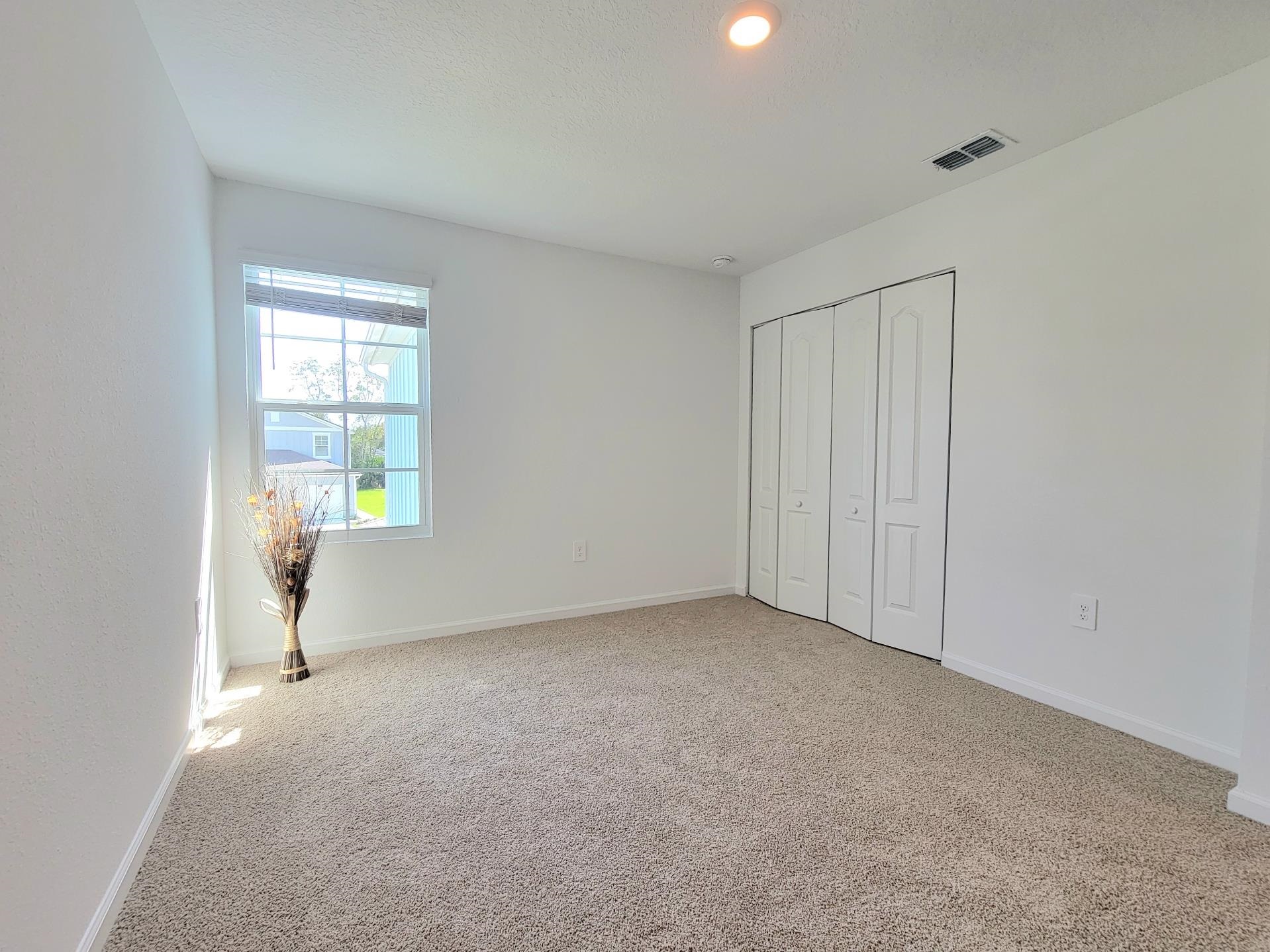 177 Tidal Bch Avenue St. Augustine, FL 32095 - Photo 20 of 39 a view of an empty room with a window