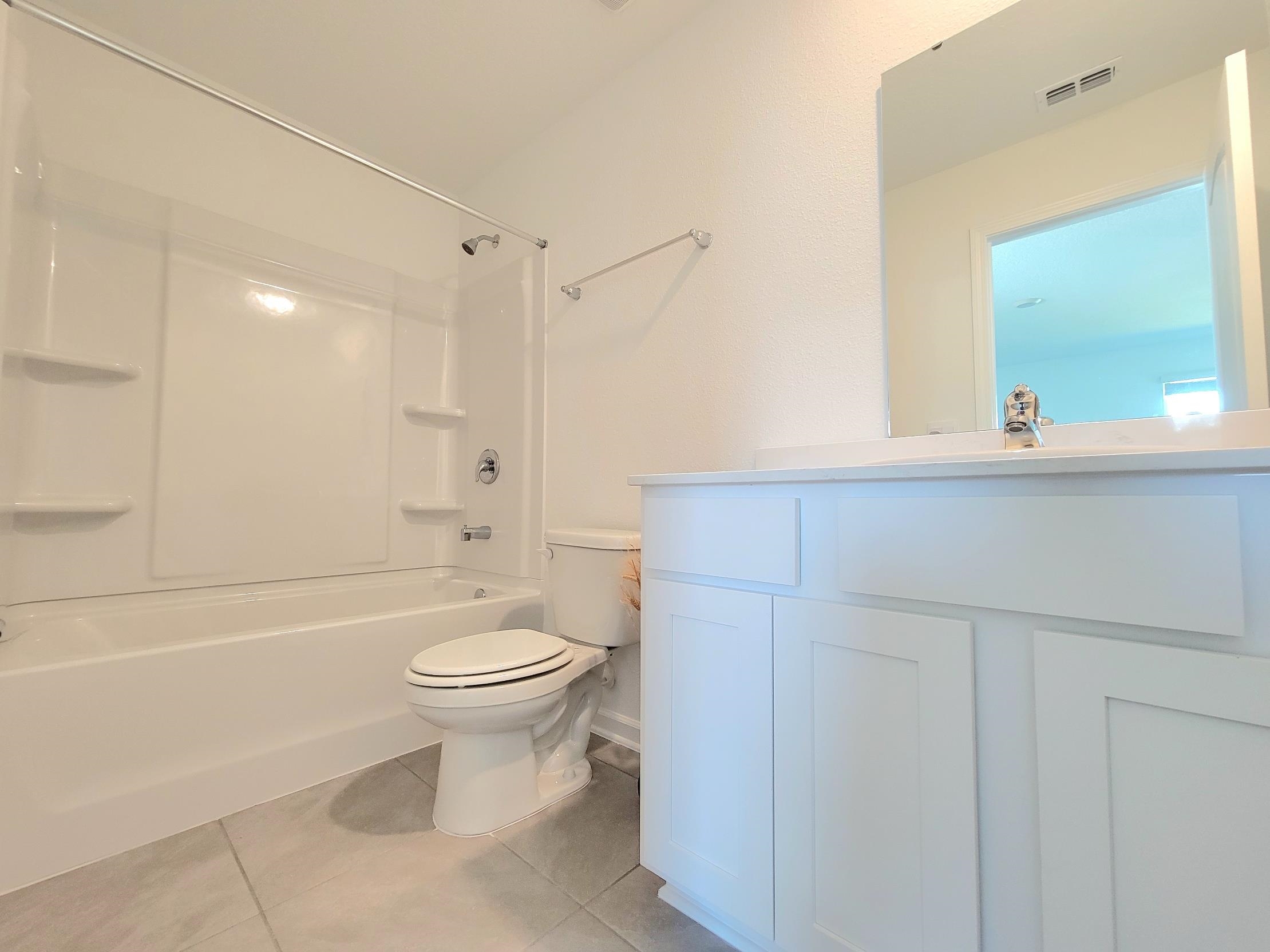 177 Tidal Bch Avenue St. Augustine, FL 32095 - Photo 22 of 39 a bathroom with a sink a toilet and shower