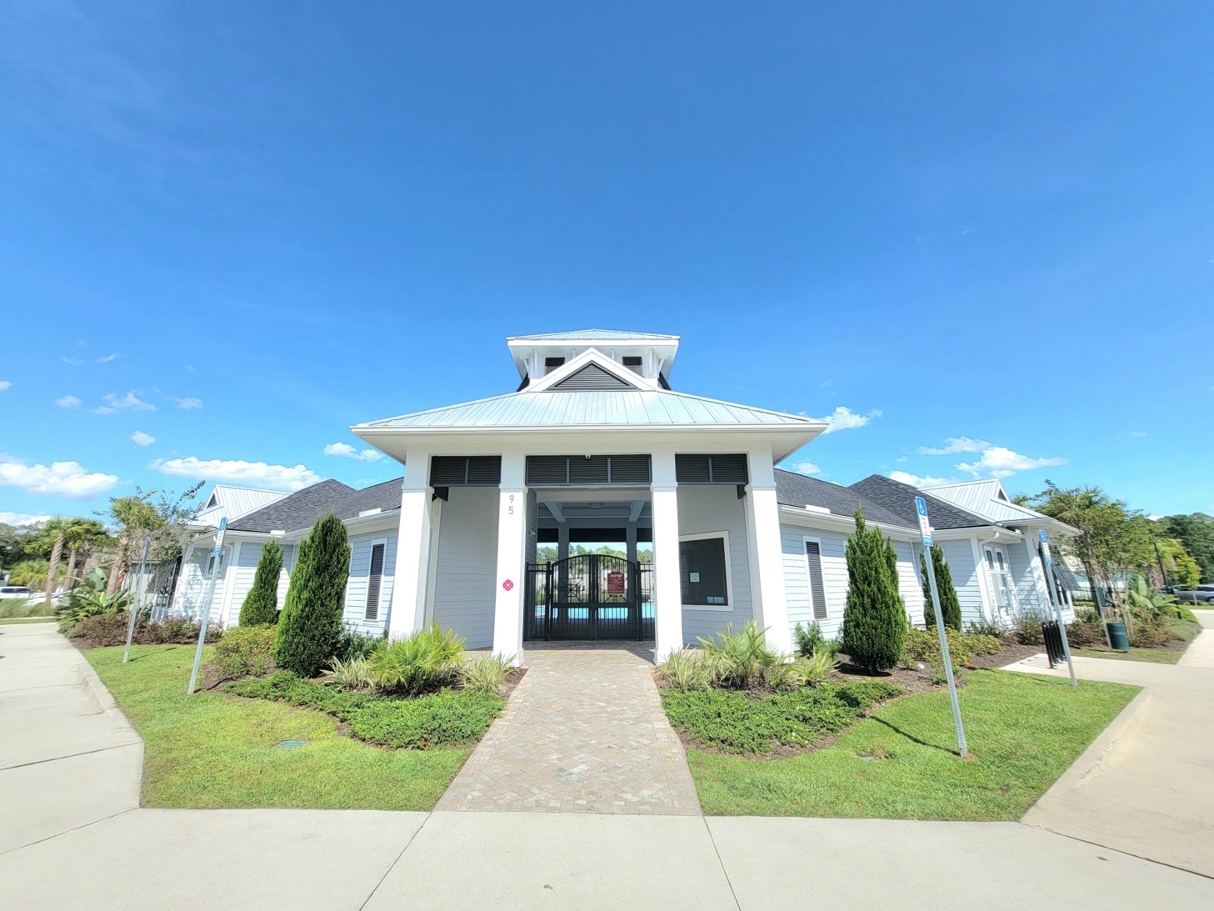 177 Tidal Bch Avenue St. Augustine, FL 32095 - Photo 30 of 39 a front view of a house with a yard and potted plants