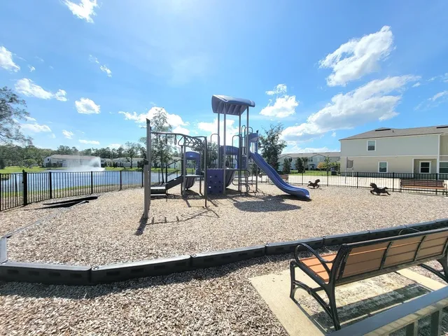 a view of a swimming pool with a lounge chair