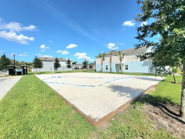 a view of a playground with basketball court