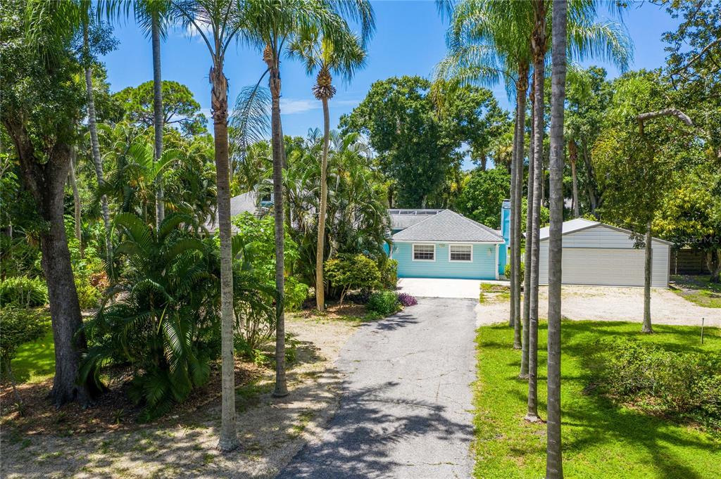 780 Rellim Lane Sarasota, FL 34232 - Photo 1 of 1 Step into your own private oasis and serene sanctuary, nestled on over an acre of lush land!