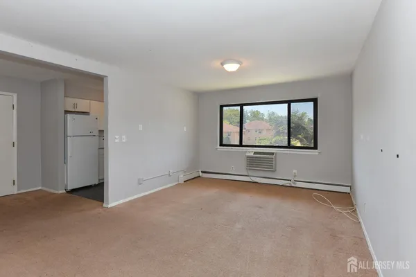an empty room with a empty space and windows
