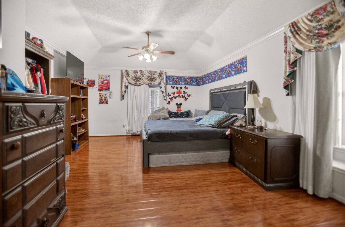 14731 Ridgechase Lane Houston, TX 77014 - Photo 12 of 29 a living room with furniture and a flat screen tv