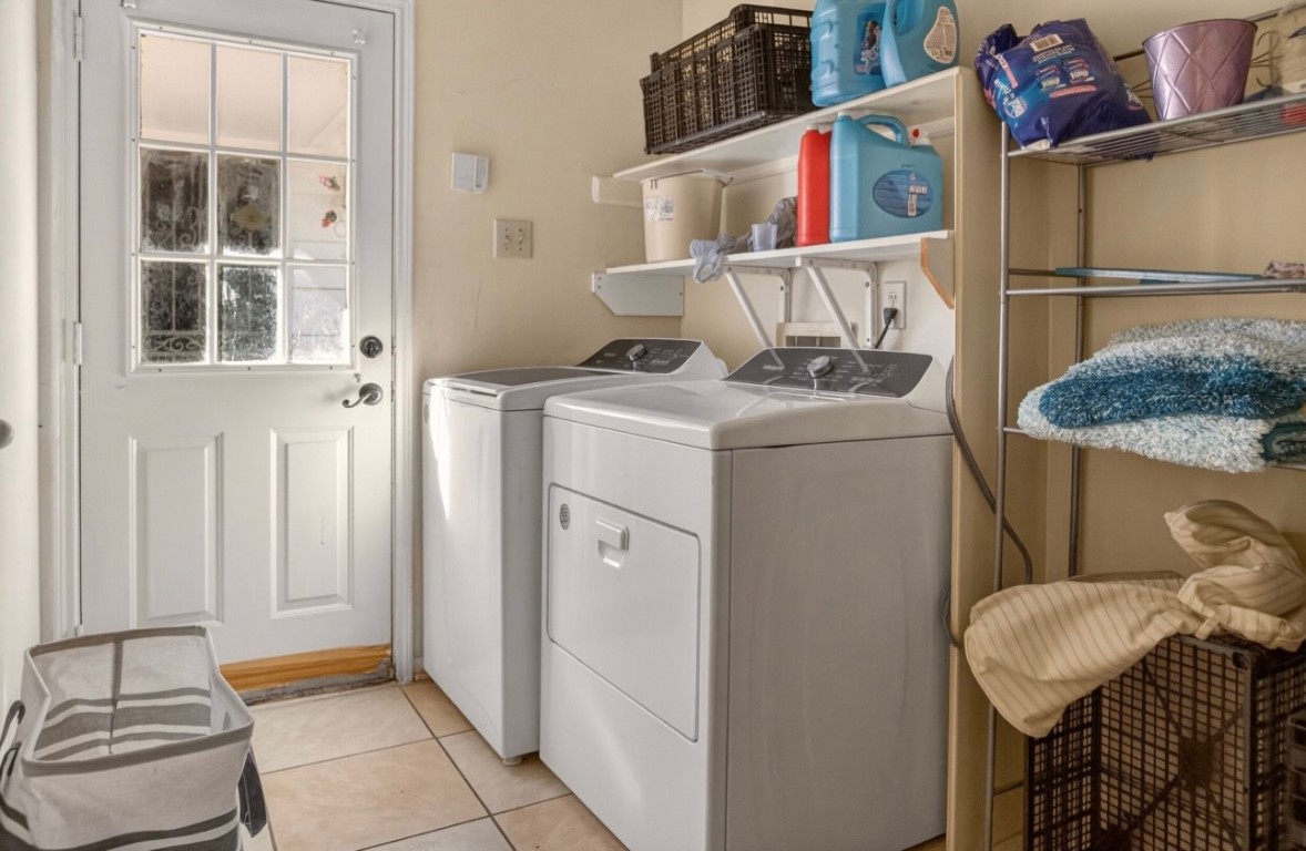14731 Ridgechase Lane Houston, TX 77014 - Photo 16 of 29 a utility room with dryer and washer