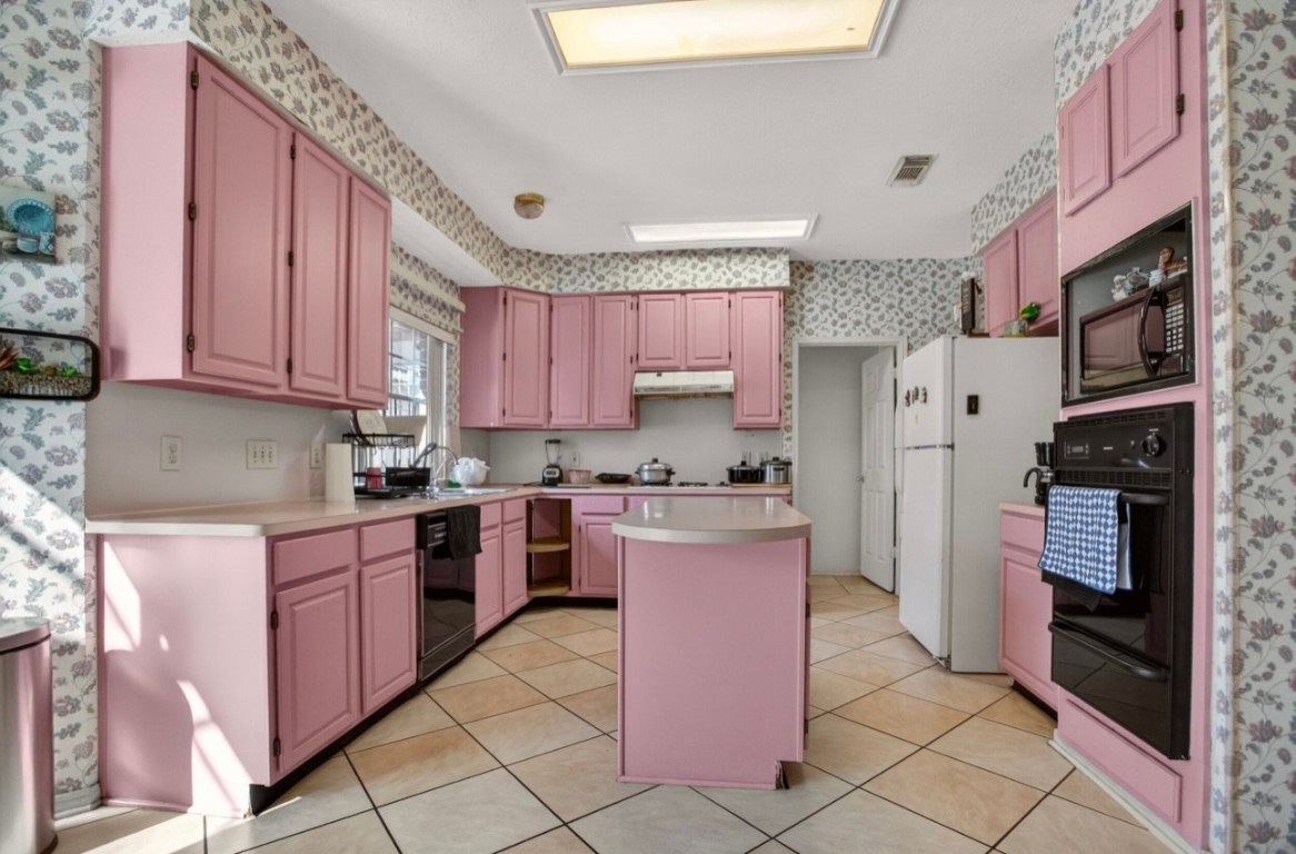 14731 Ridgechase Lane Houston, TX 77014 - Photo 17 of 29 a kitchen with stainless steel appliances granite countertop a stove top oven a sink dishwasher and a refrigerator