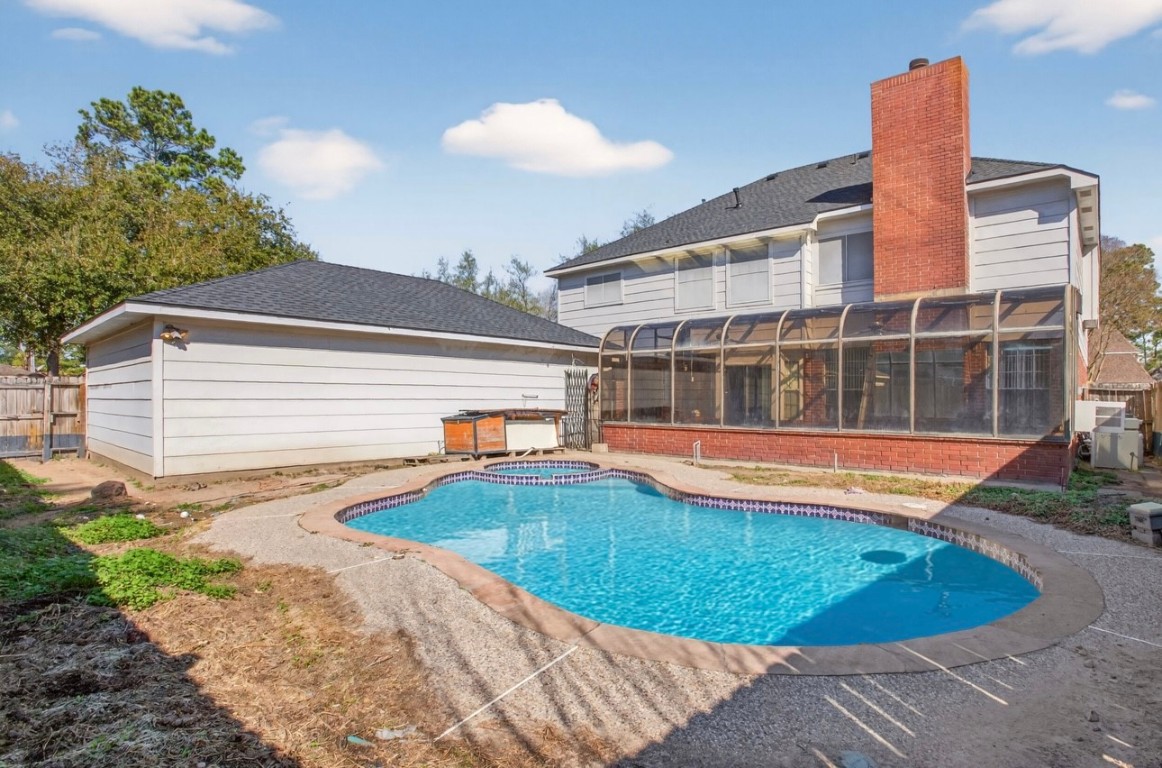 14731 Ridgechase Lane Houston, TX 77014 - Photo 21 of 29 a view of a house with swimming pool