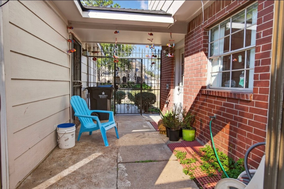 14731 Ridgechase Lane Houston, TX 77014 - Photo 23 of 29 a view of a patio with table and chairs and potted plants
