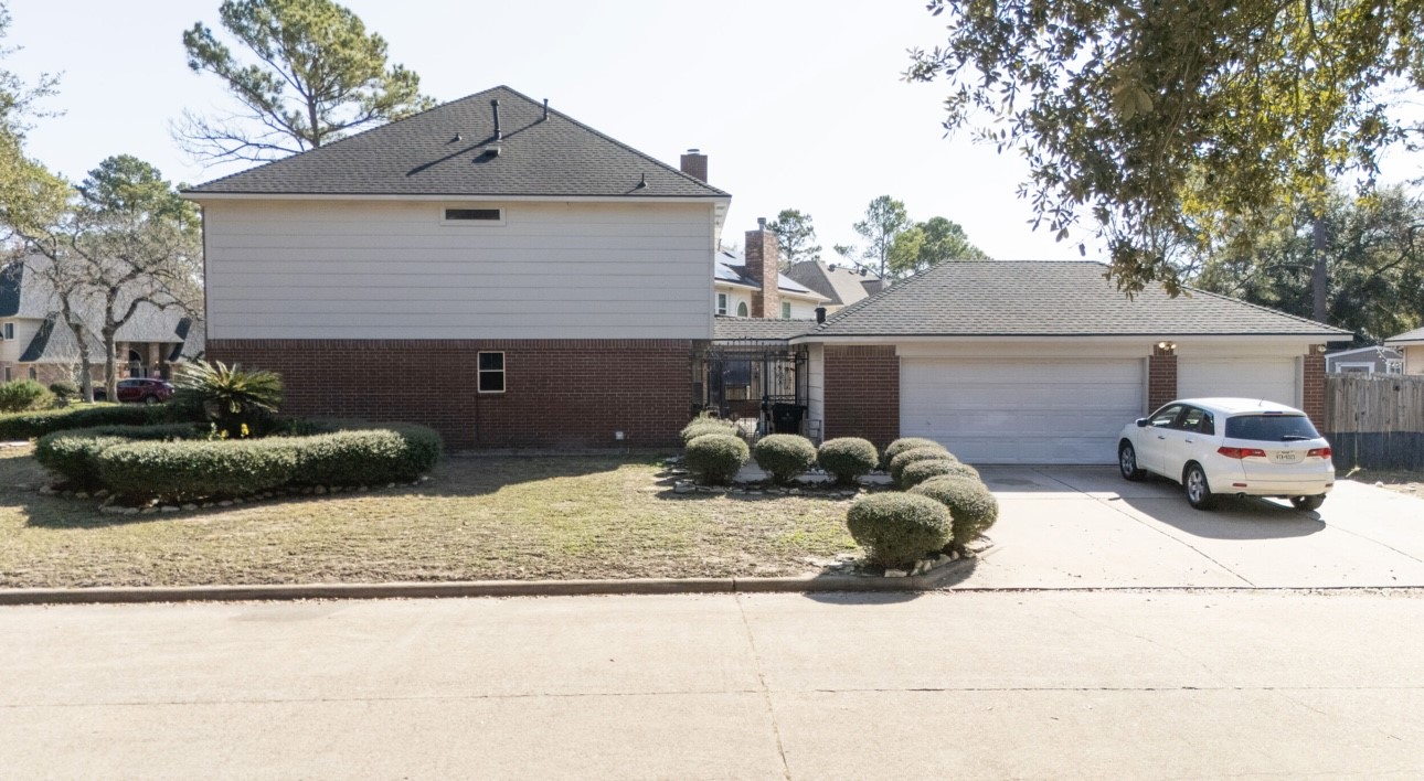14731 Ridgechase Lane Houston, TX 77014 - Photo 24 of 29 a front view of a house with garage