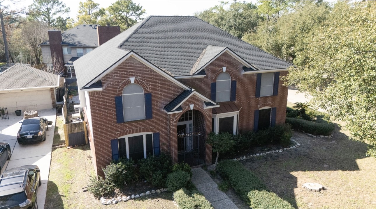 14731 Ridgechase Lane Houston, TX 77014 - Photo 26 of 29 a aerial view of a house next to a yard