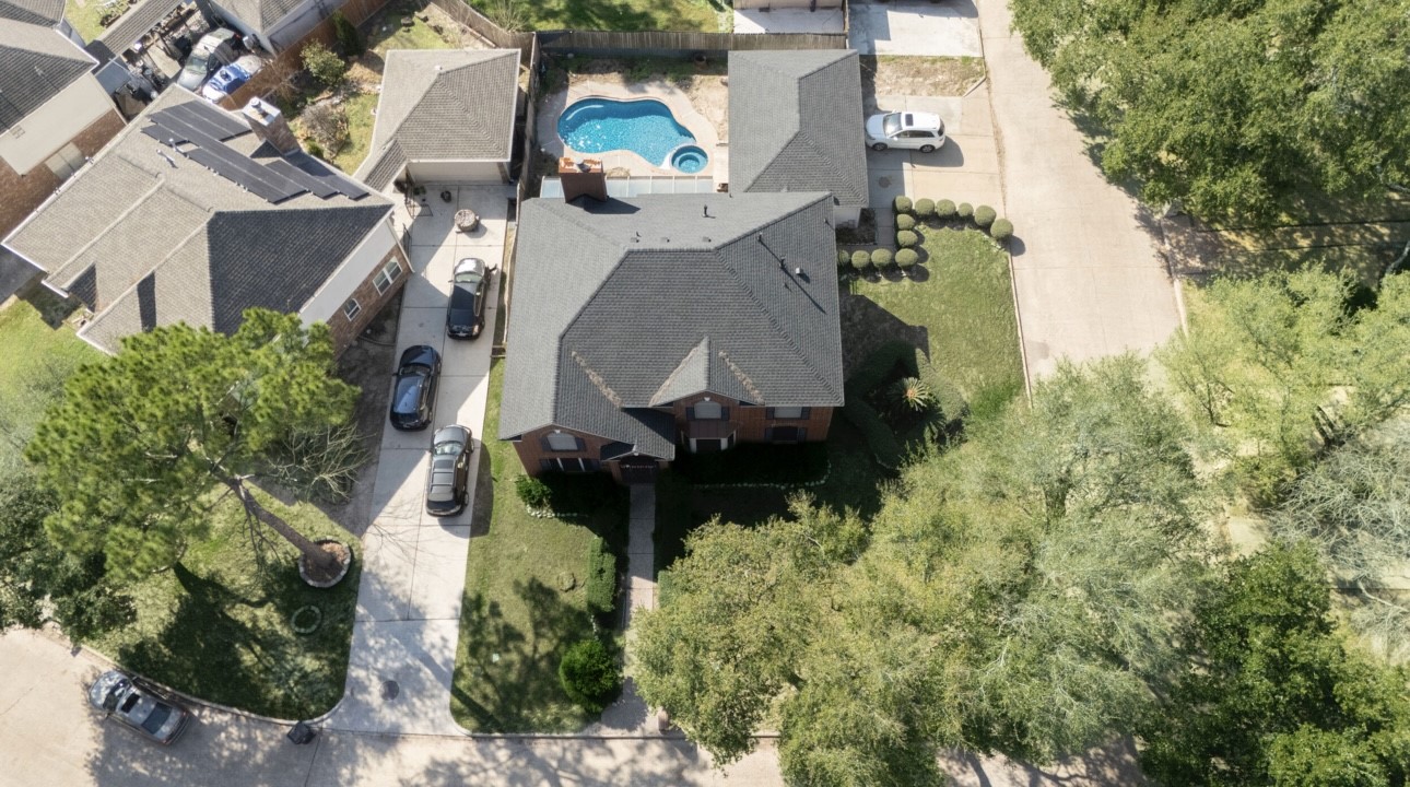 14731 Ridgechase Lane Houston, TX 77014 - Photo 27 of 29 an aerial view of a house with a yard and trees