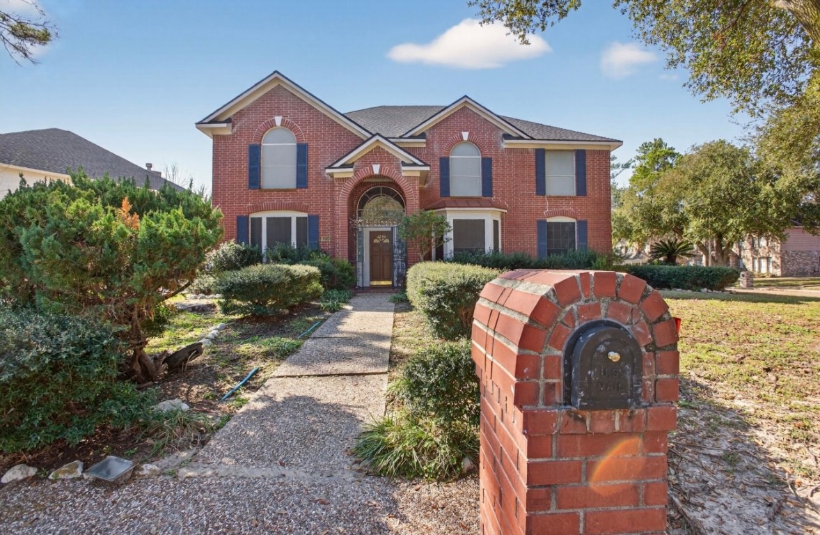 14731 Ridgechase Lane Houston, TX 77014 - Photo 7 of 29 a front view of a house with a yard