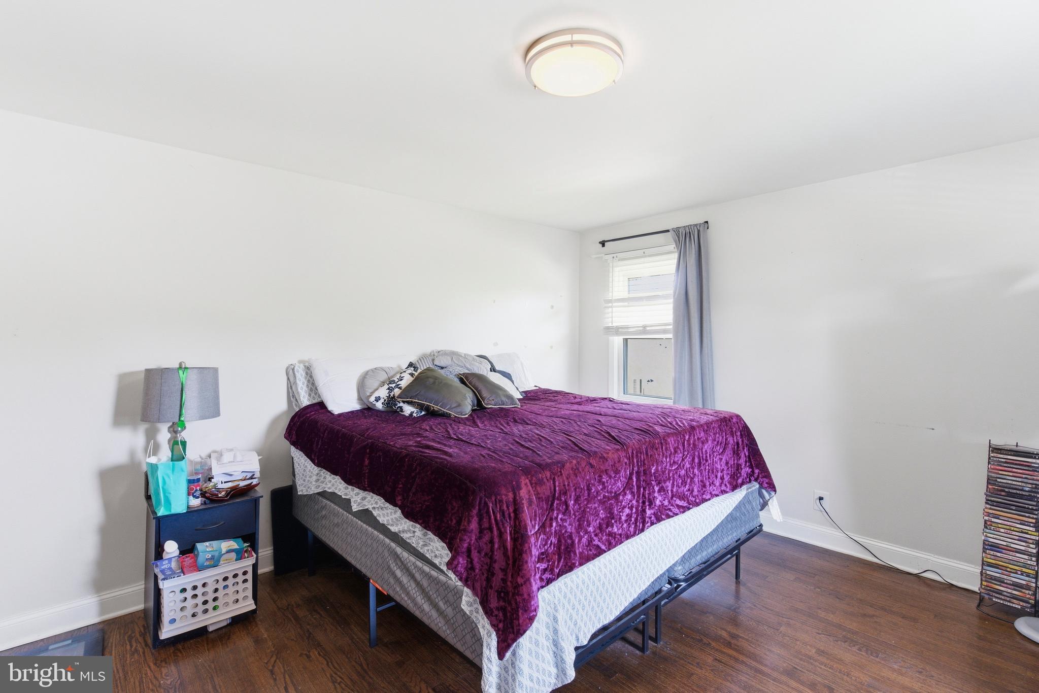 912 Shelley Road Towson, MD 21286 - Photo 14 of 27 a bed sitting in a bedroom next to a window