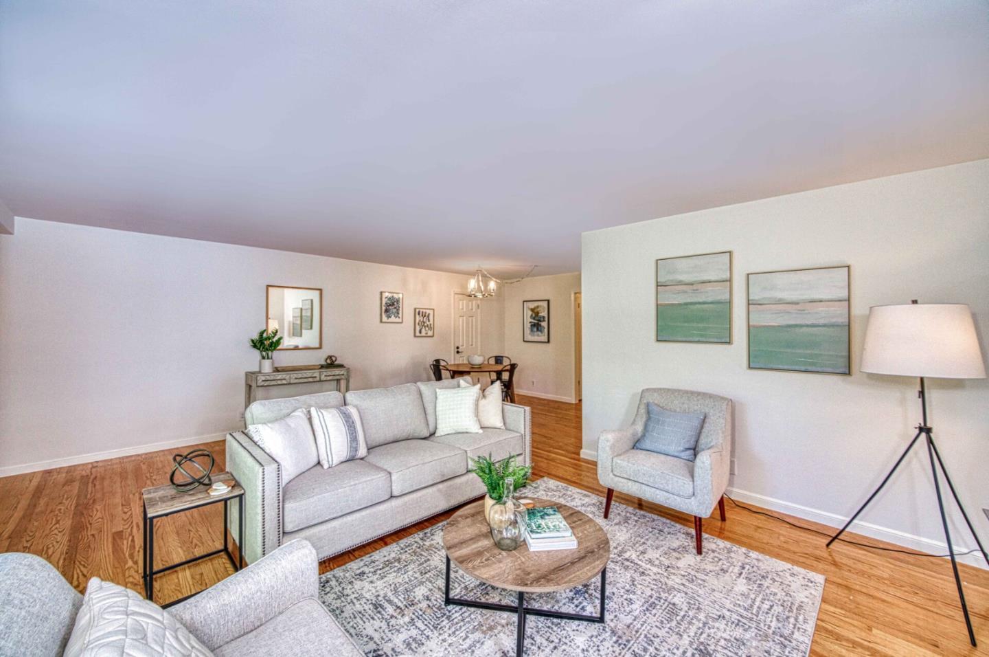 a living room with furniture and a rug