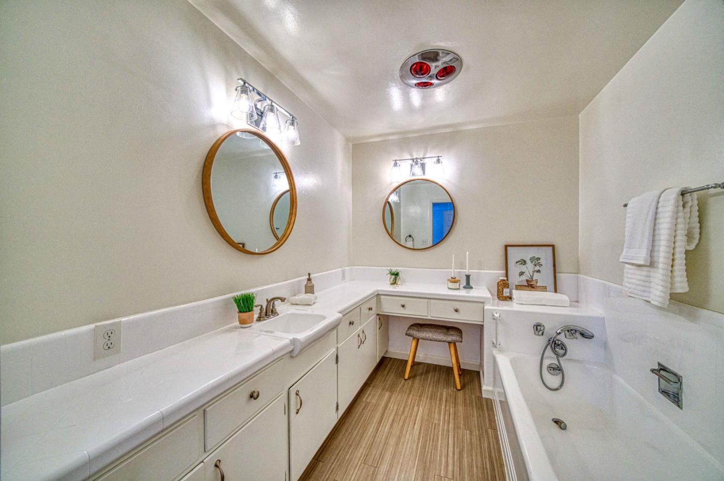 760 University Avenue Palo Alto, CA 94301 - Photo 16 of 25 a bathroom with a double vanity sink mirror and bathtub