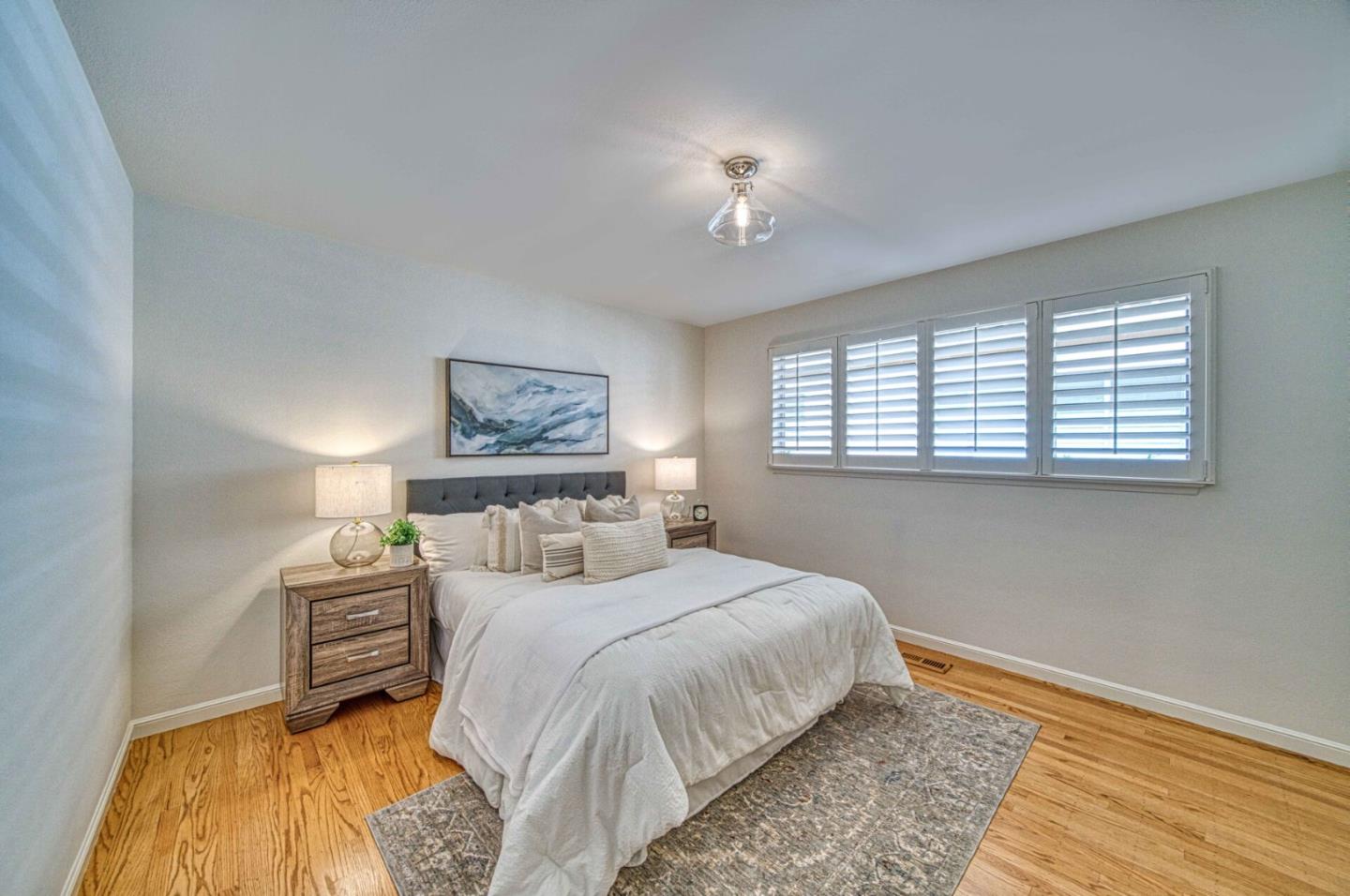 760 University Avenue Palo Alto, CA 94301 - Photo 18 of 25 a bedroom with a bed and a lamp