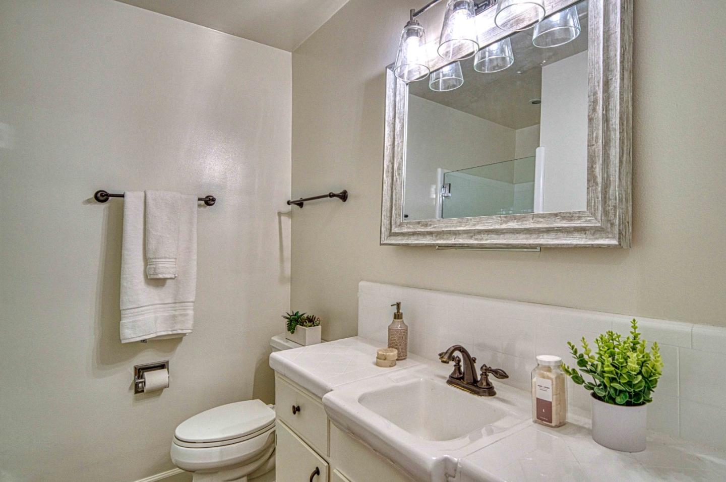 760 University Avenue Palo Alto, CA 94301 - Photo 20 of 25 a bathroom with a sink a toilet and mirror