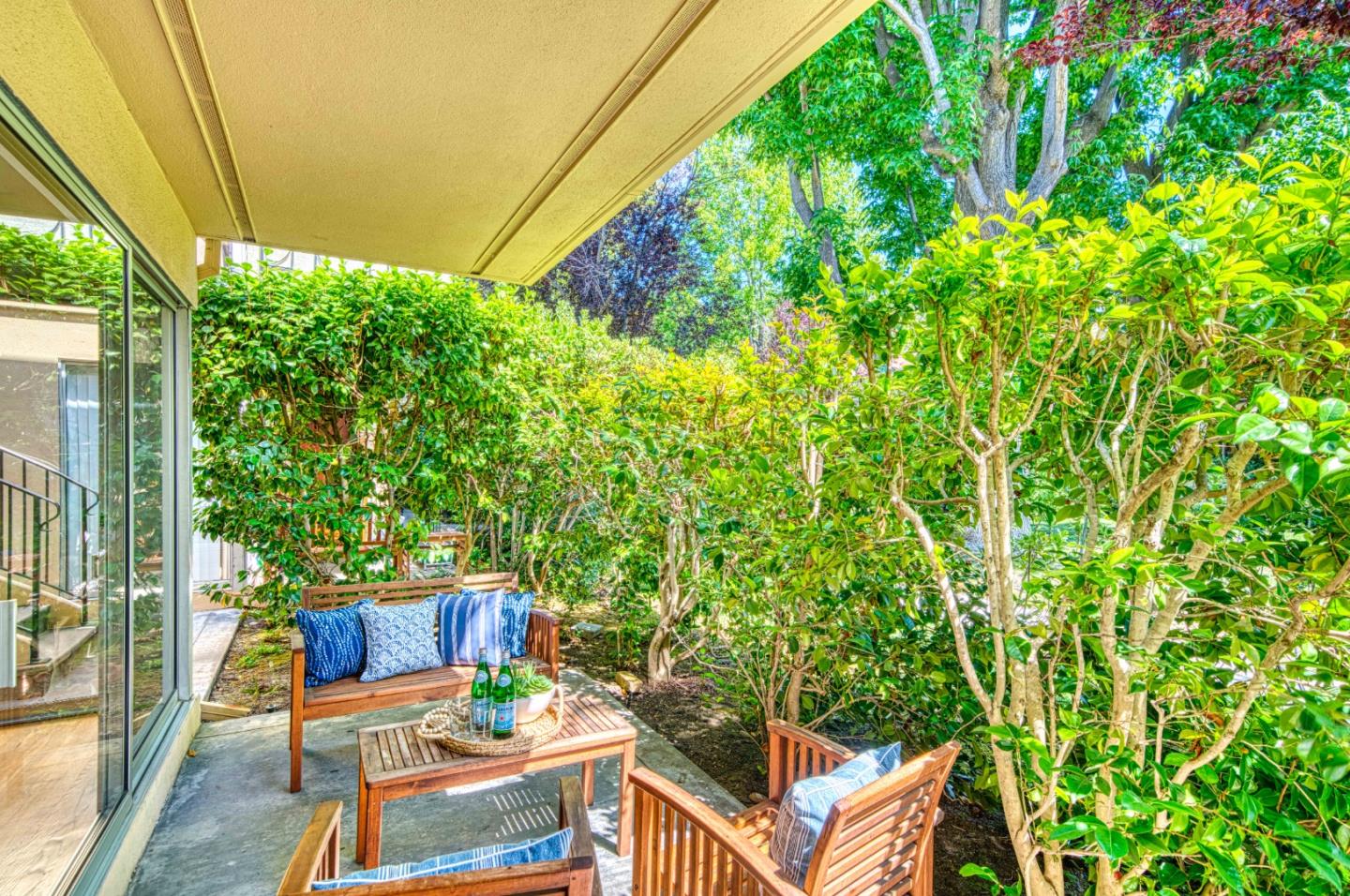 760 University Avenue Palo Alto, CA 94301 - Photo 4 of 25 a view of a patio with table and chairs and potted plants