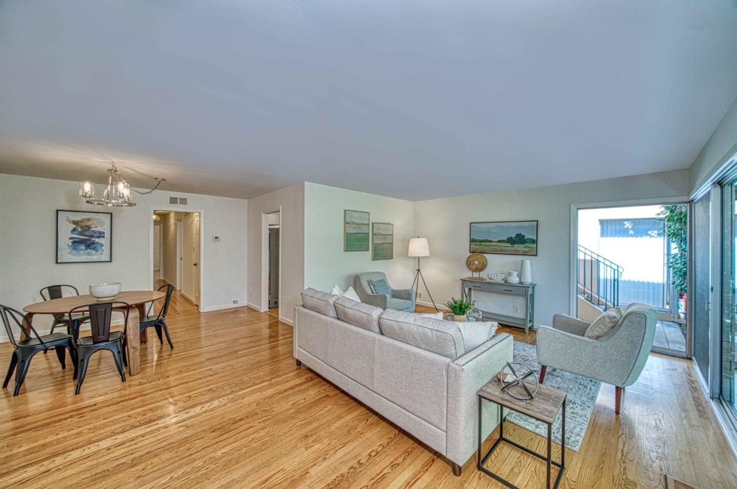 760 University Avenue Palo Alto, CA 94301 - Photo 6 of 25 a living room with furniture wooden floor and a dining table