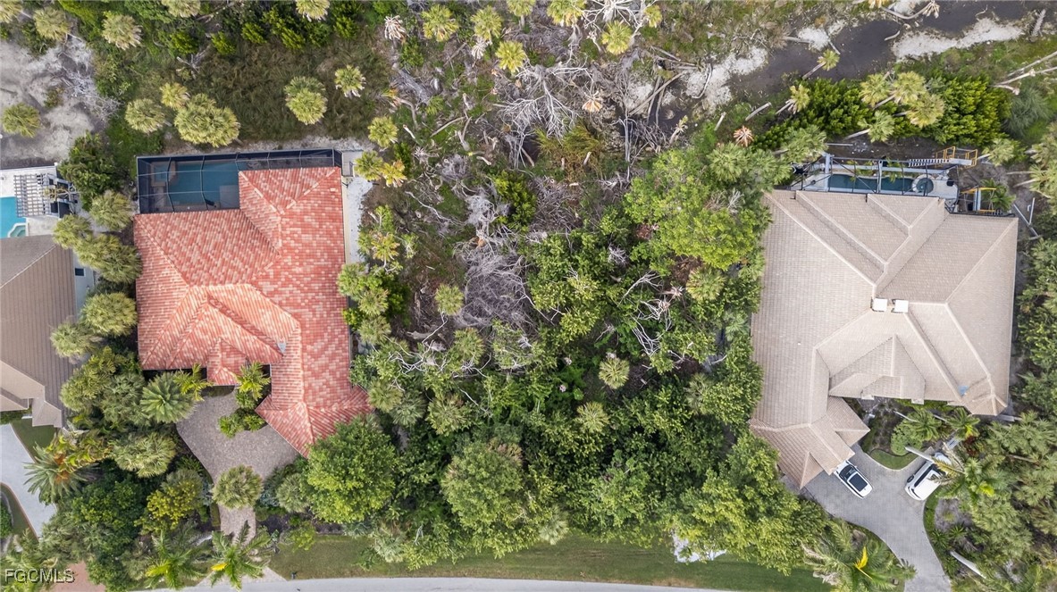2372 Wulfert Road Sanibel, FL 33957 - Photo 12 of 12 an aerial view of a house with a yard and garden